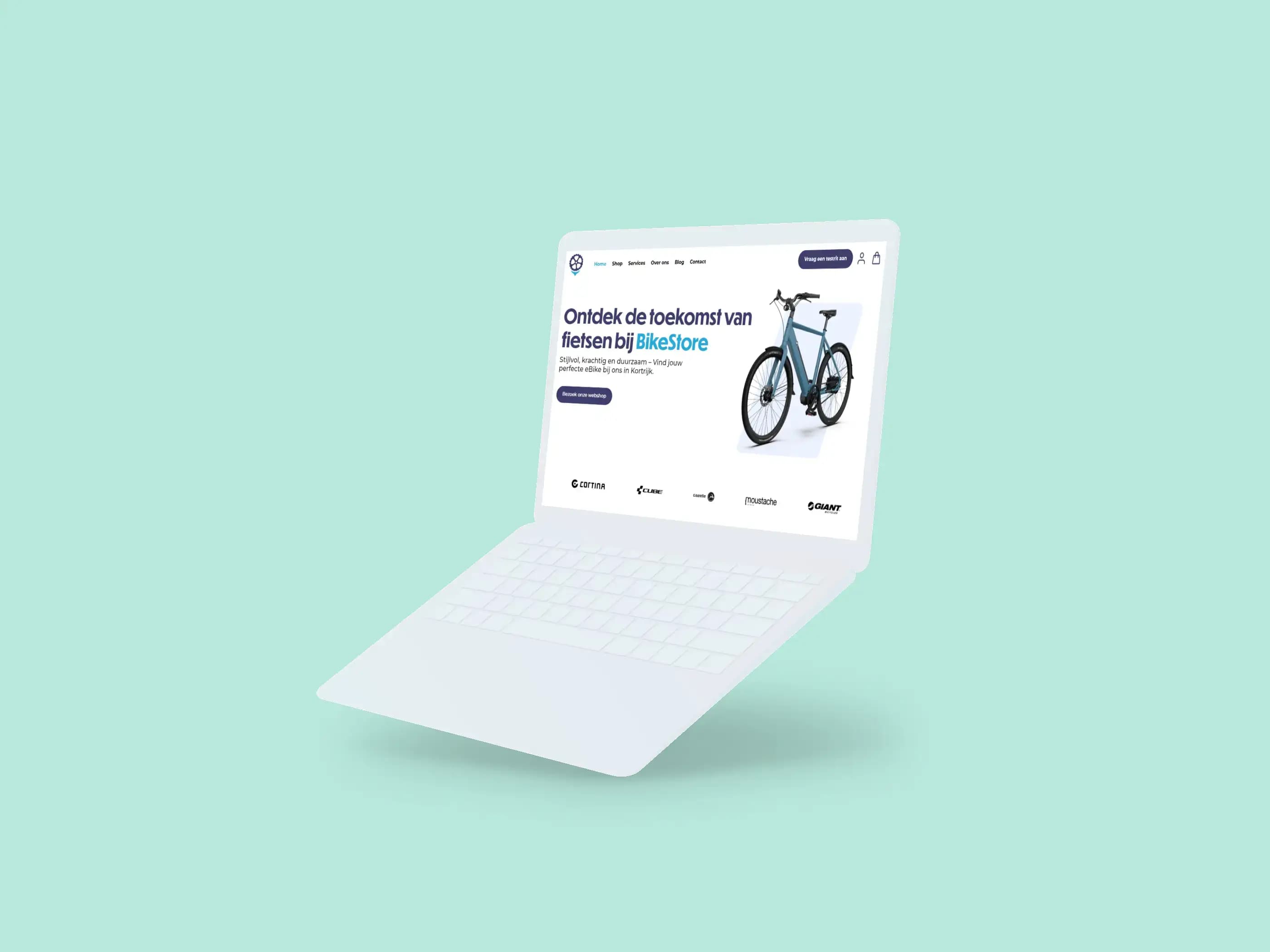 White laptop shows an e-commerce website advertising a sleek modern bicycle.
