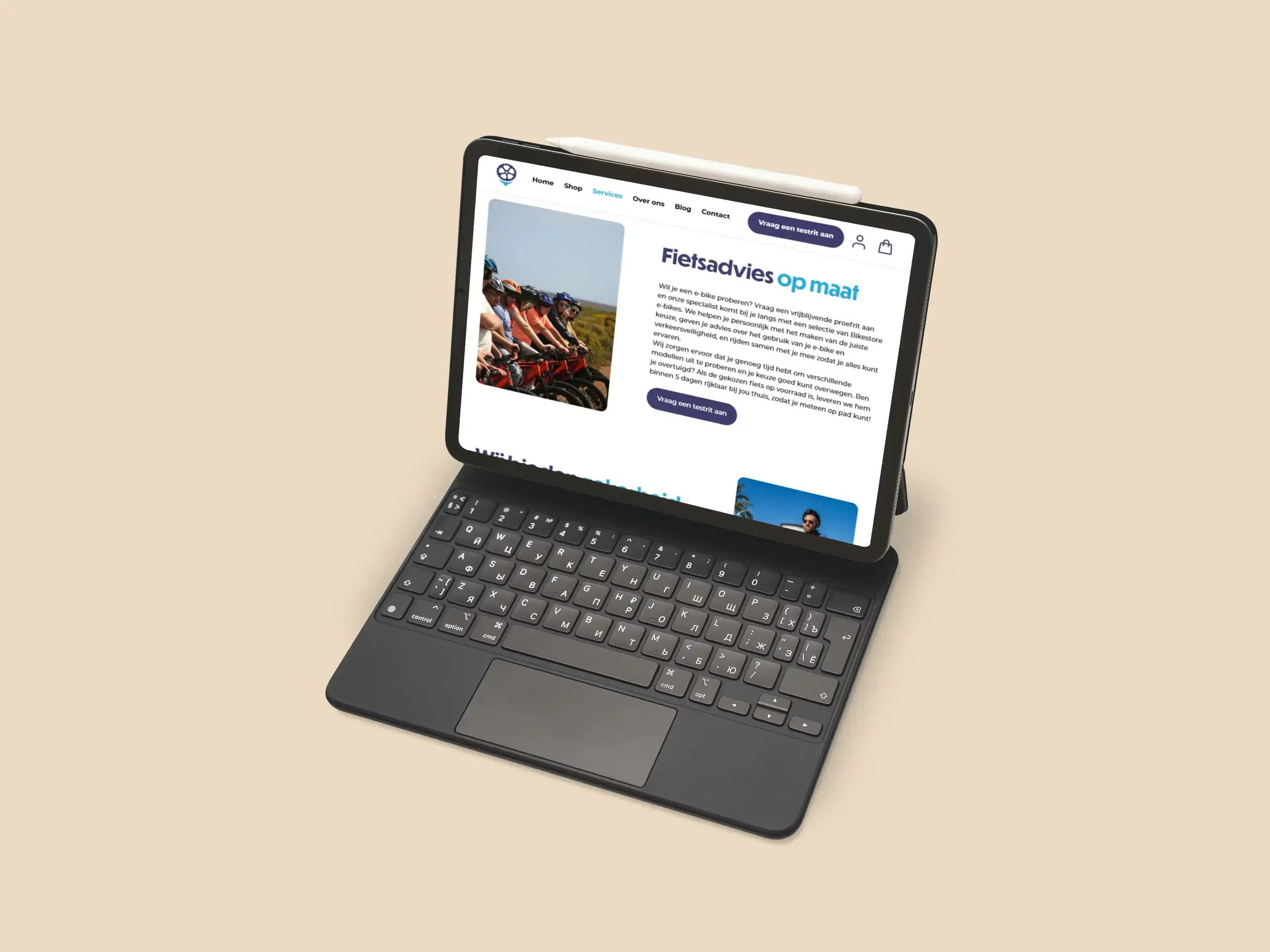 Tablet with keyboard displaying a website featuring an image and text content.